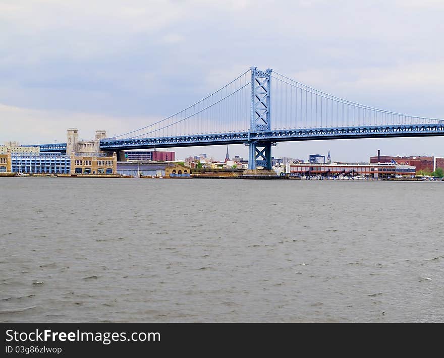 Benjamin Franklin Bridge as seen from the New Jersey side of the Delaware River with Philadelphia, Pennsylvania in the background. Benjamin Franklin Bridge as seen from the New Jersey side of the Delaware River with Philadelphia, Pennsylvania in the background.