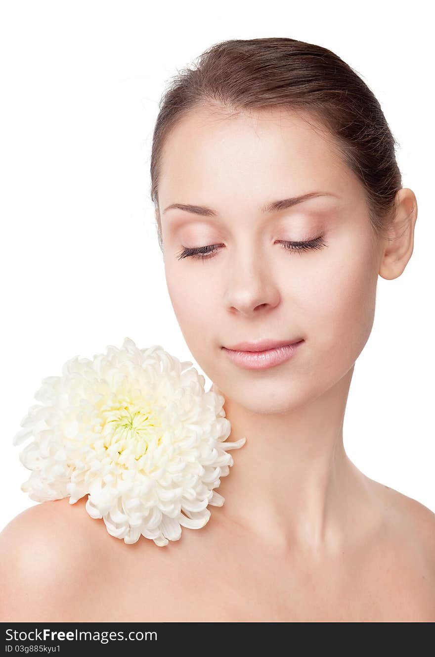 Beautiful girl with flower on a shoulder on a white background