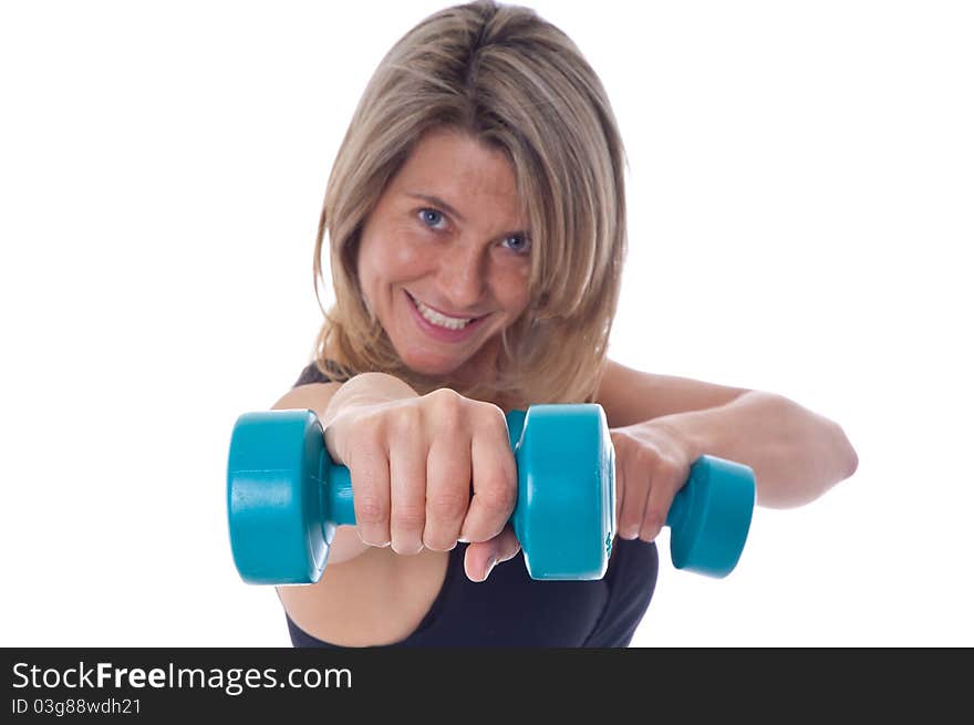 Active Woman doing exercises with dumbels