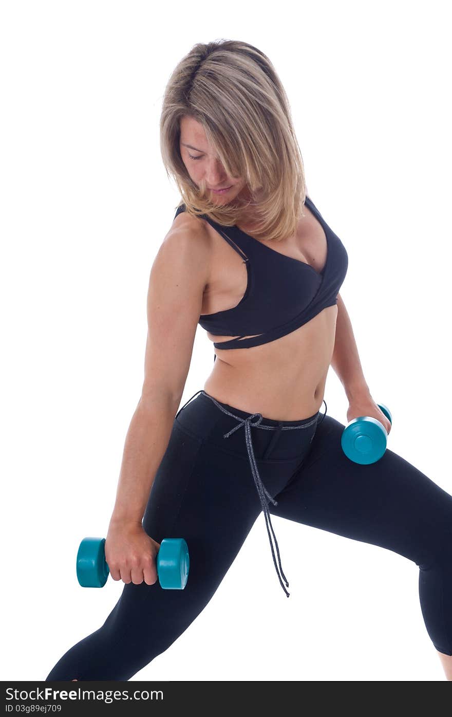 Active Woman doing exercises with dumbels