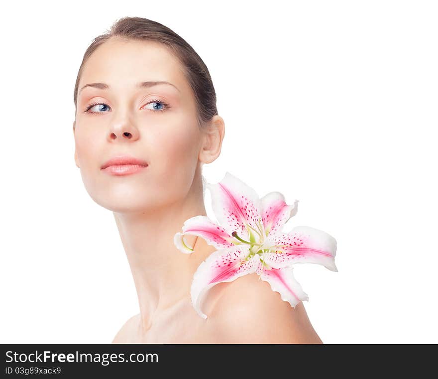 Beautiful girl with lily on a shoulder on a white background, closeup, textspace. Beautiful girl with lily on a shoulder on a white background, closeup, textspace