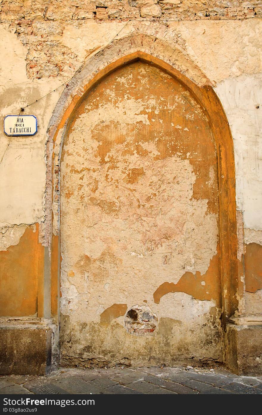 Old Wall In Italy With Sign