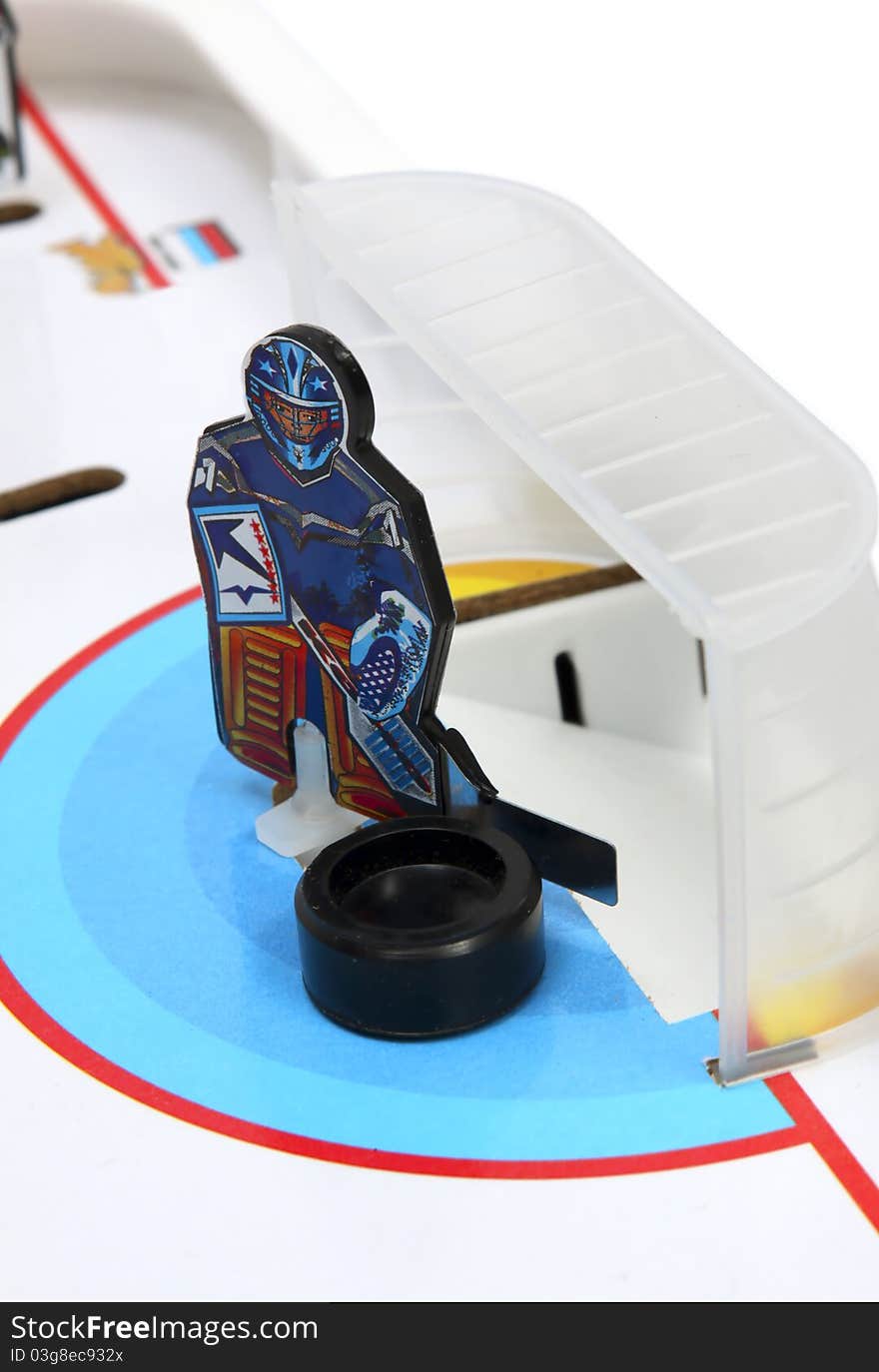 Hockey player - goal keeper on the ice field background.