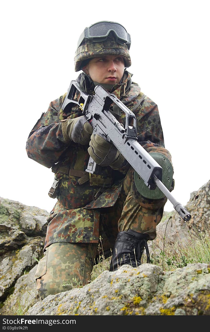 Soldier with automatic gun covering