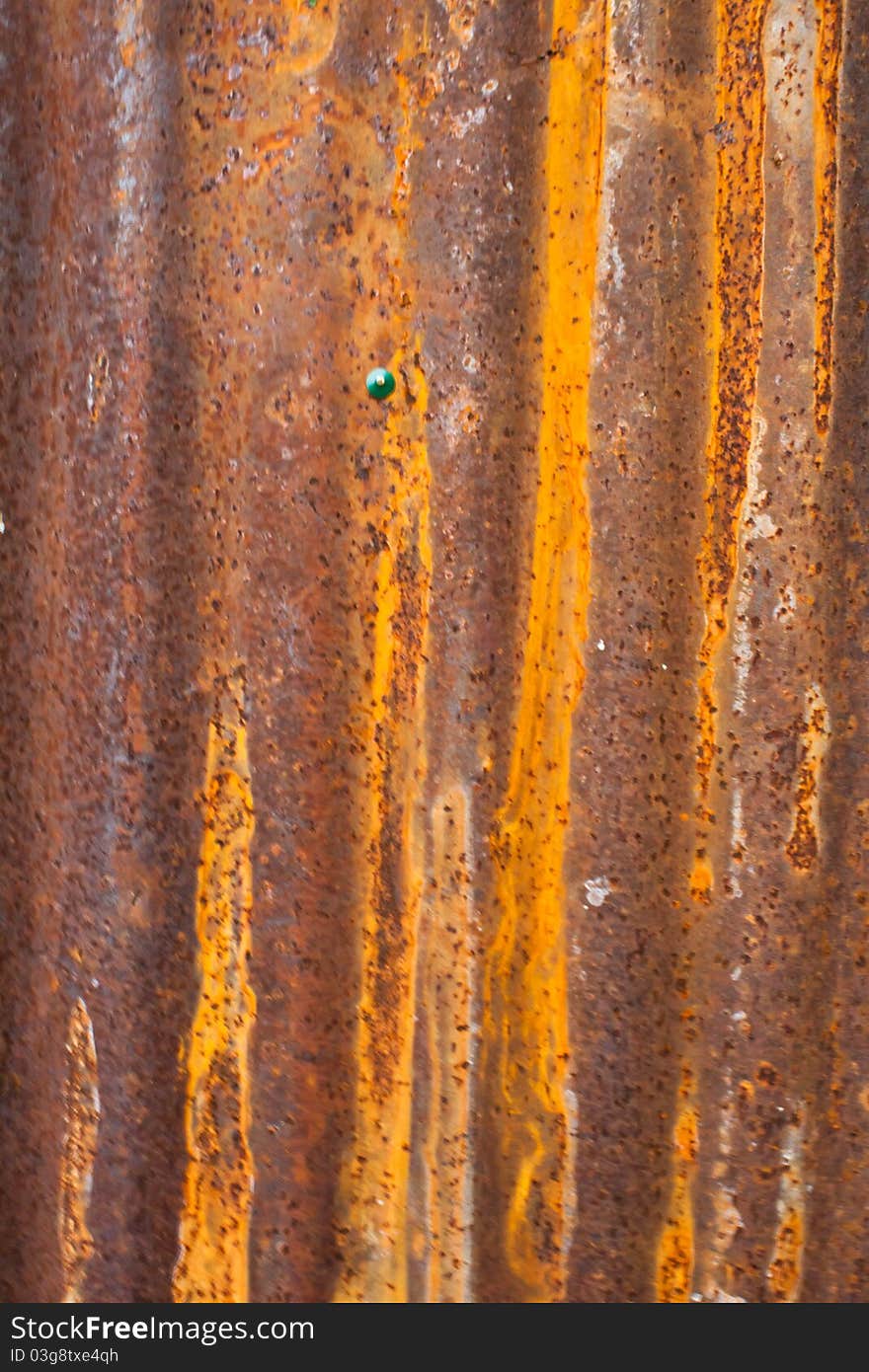 A rusty corrugated iron metal fence close up/ Zinc wall