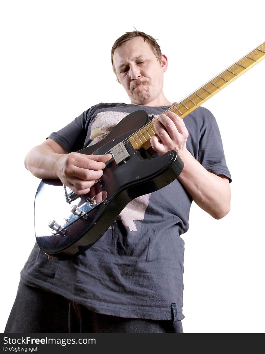 Color photo of a man with an electric guitar in his hands. Color photo of a man with an electric guitar in his hands