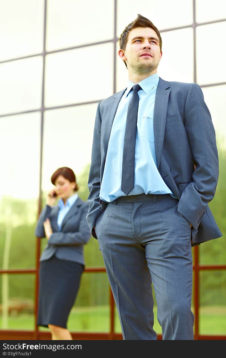 Businesspeople in front of building