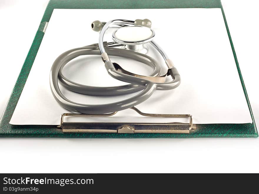 Stethoscope and clipboard isolated on white background