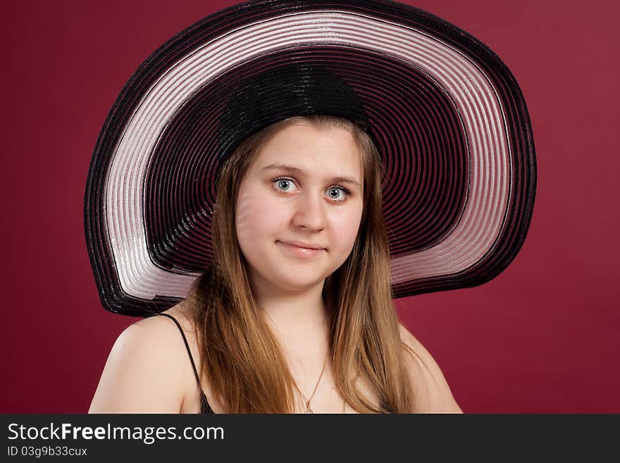 Girl standing in studio isolated on red background. Girl standing in studio isolated on red background