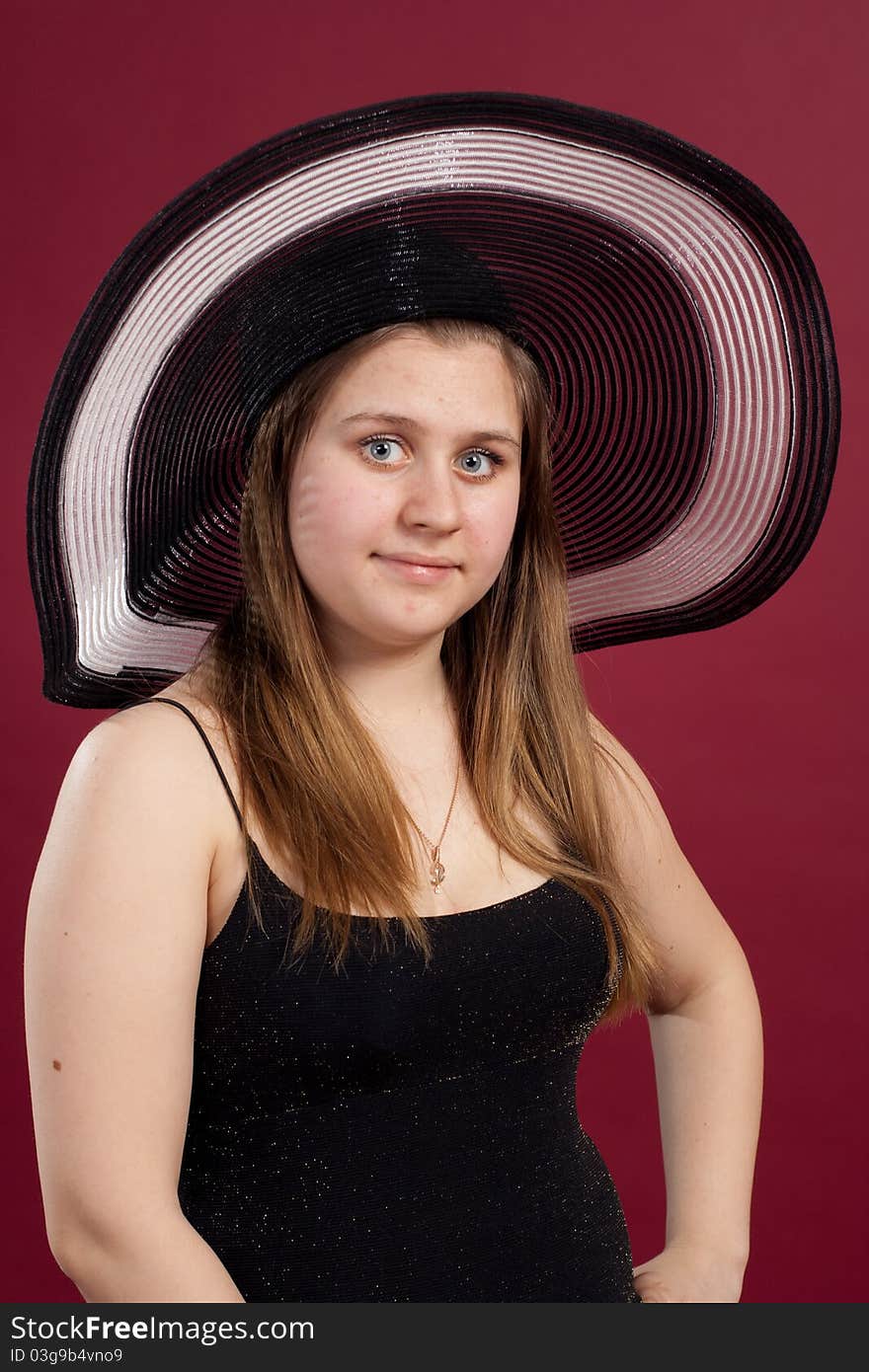 Girl standing in studio isolated on red background. Girl standing in studio isolated on red background