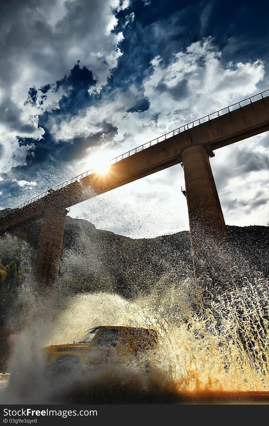 Vehicle at speed splashing out water. Vehicle at speed splashing out water.