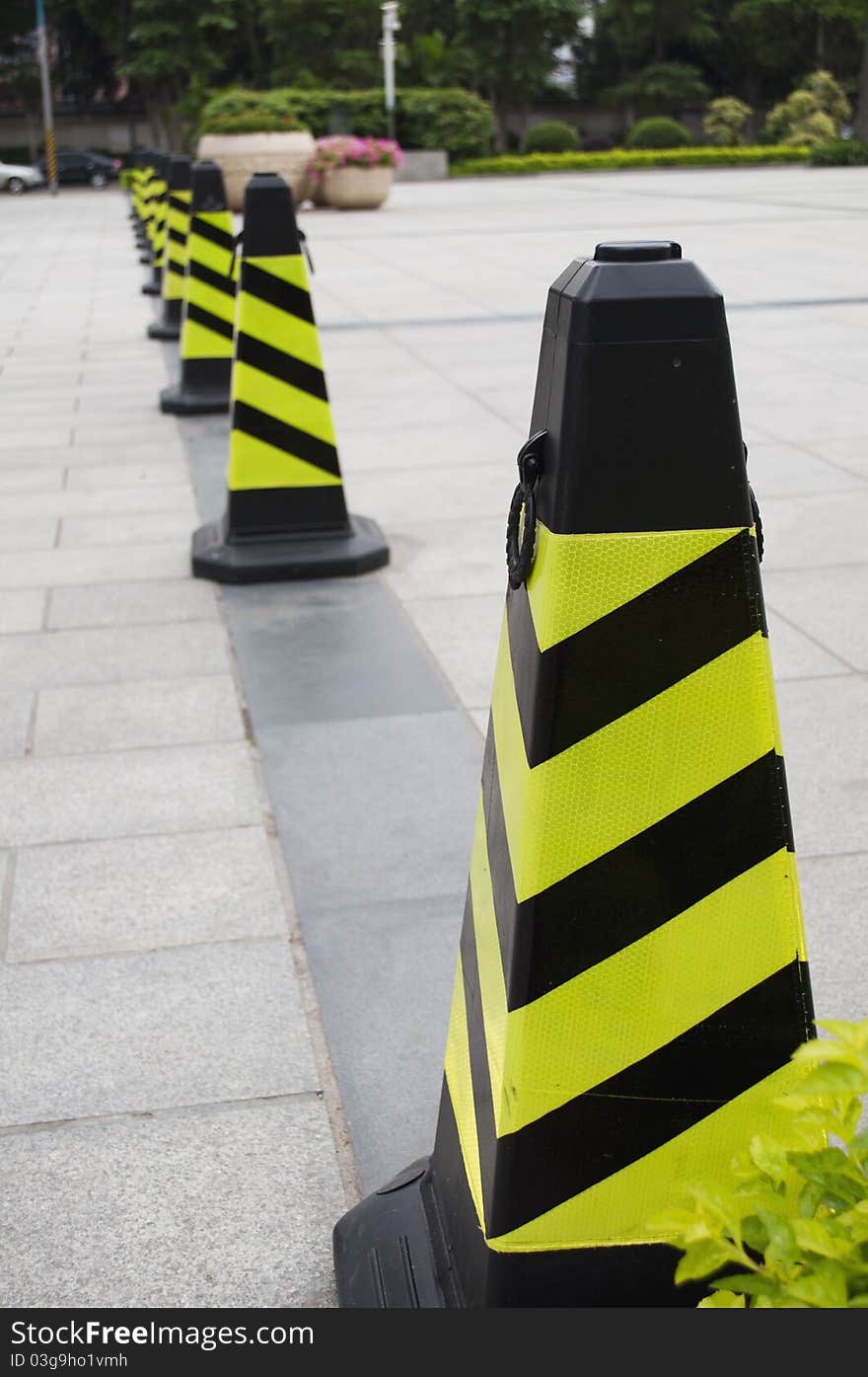 A road cone with reflective bands. A road cone with reflective bands