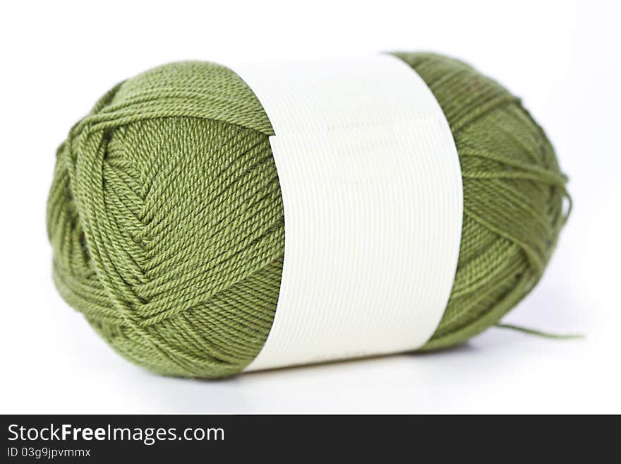 Green woolen a thread whith white background. Green woolen a thread whith white background