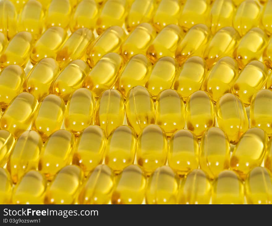 Fishoil capsules close up as background