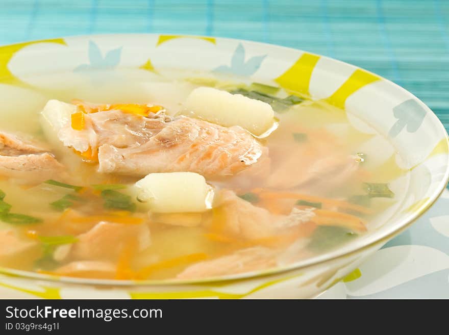 Salmon soup, potato and vegetables