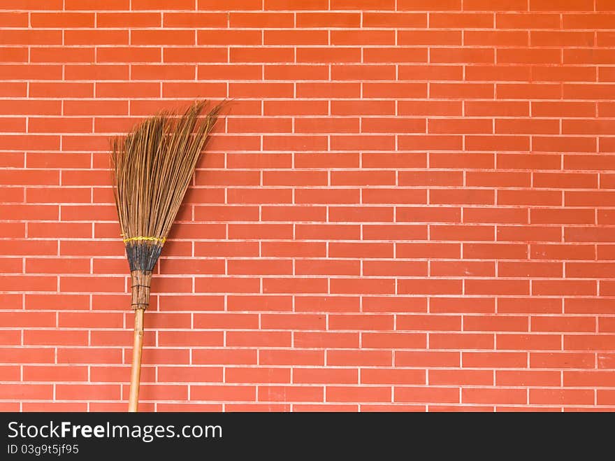 Broom On Brick Wall