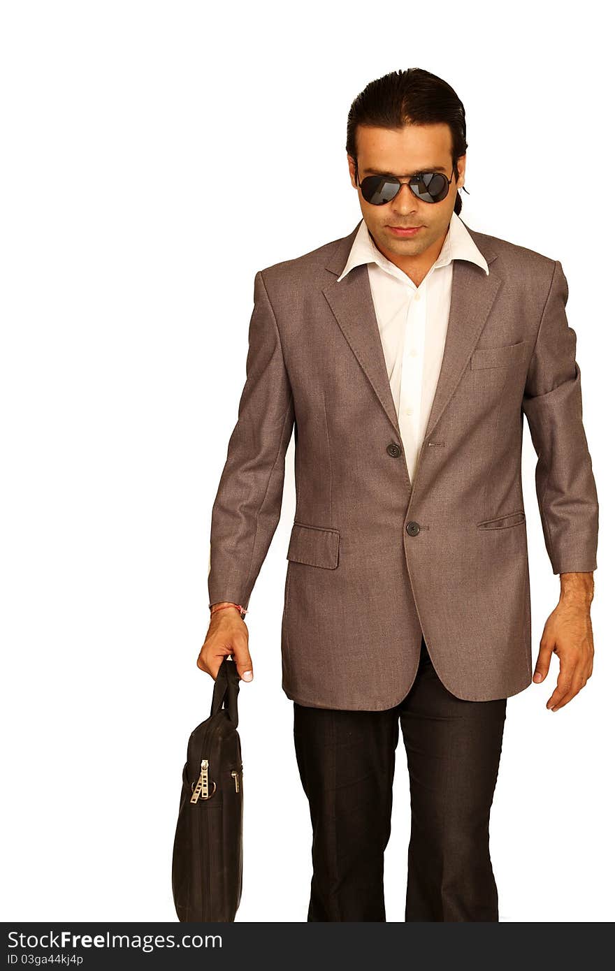 Portrait of an Indian business man isolated over white background. Studio shot. Portrait of an Indian business man isolated over white background. Studio shot.