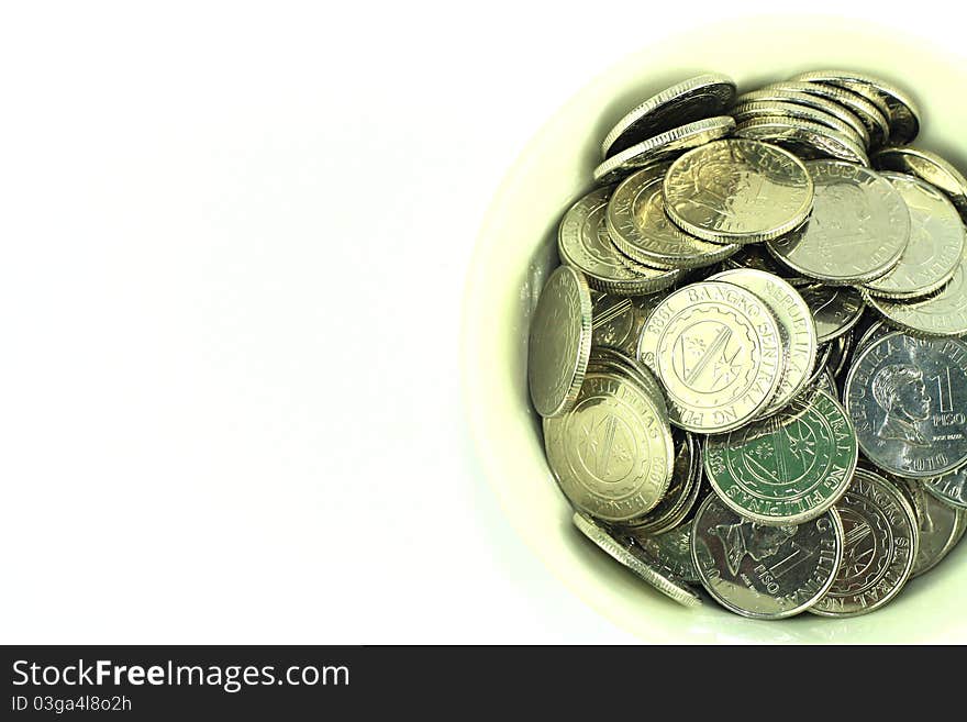 Silver coins in a bowl