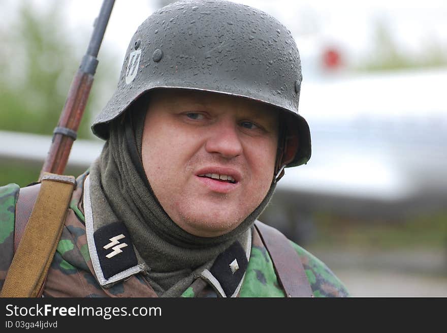 Member of Red Star history club wears historical German uniform during historical reenactment of WWII in Kiev,Ukraine. Member of Red Star history club wears historical German uniform during historical reenactment of WWII in Kiev,Ukraine