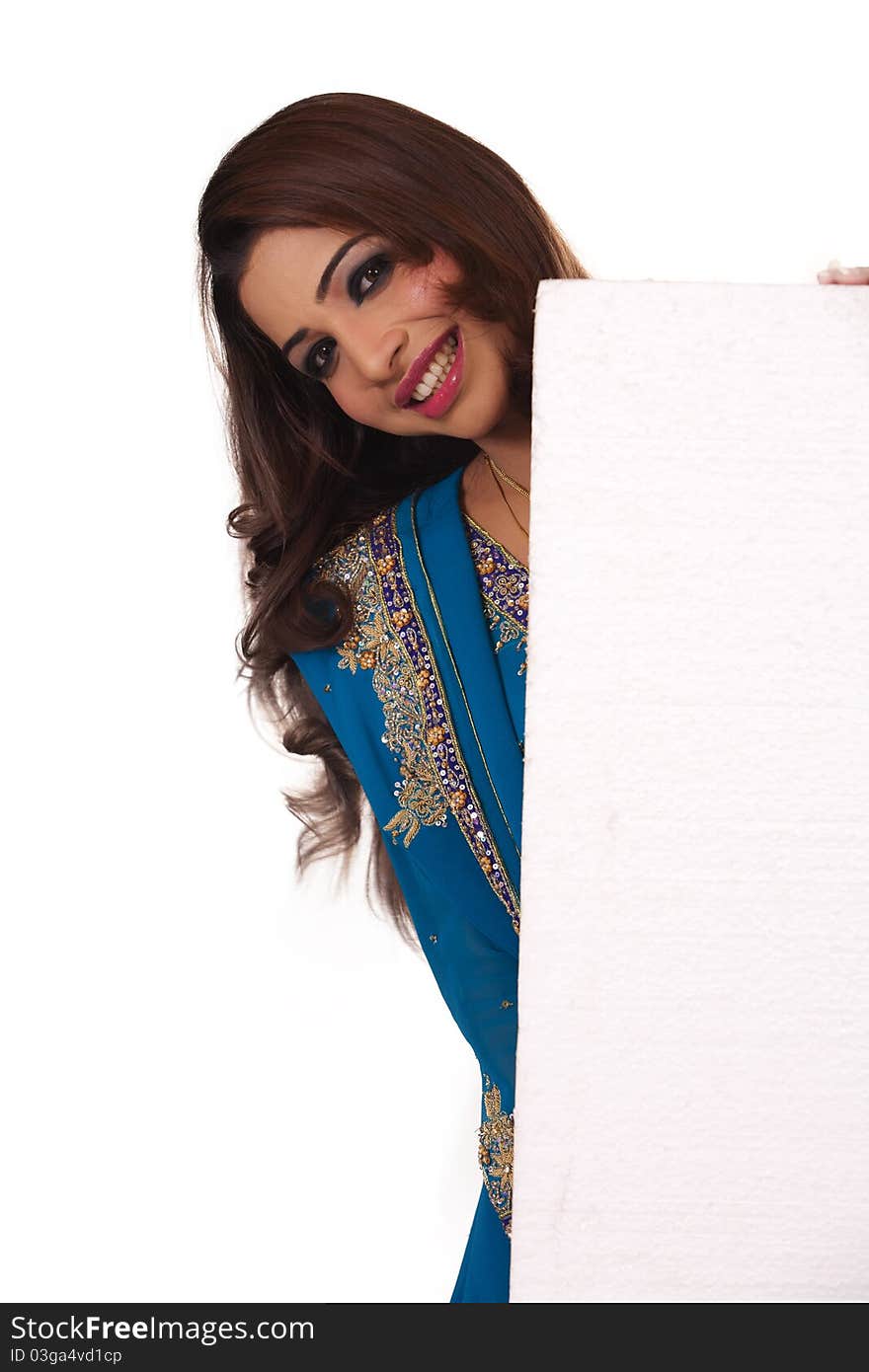 Smiling asian girl with ad space. Isolated on white background.