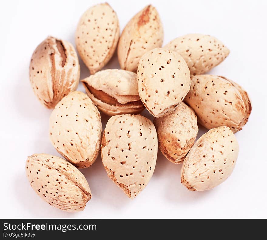 Handful of almonds isolated on white background. Handful of almonds isolated on white background