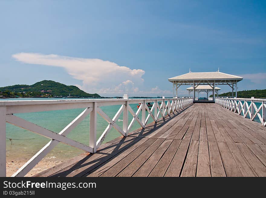 White bridge in to the sea  tilted to the right with beautiful blue sky. White bridge in to the sea  tilted to the right with beautiful blue sky