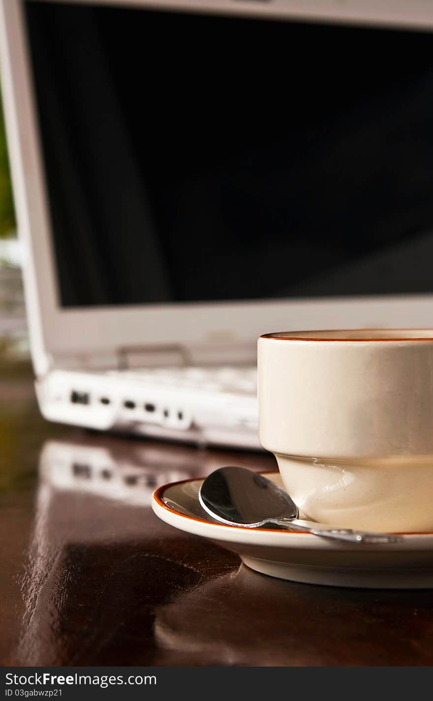 A Cup Of Coffee And White Notebook