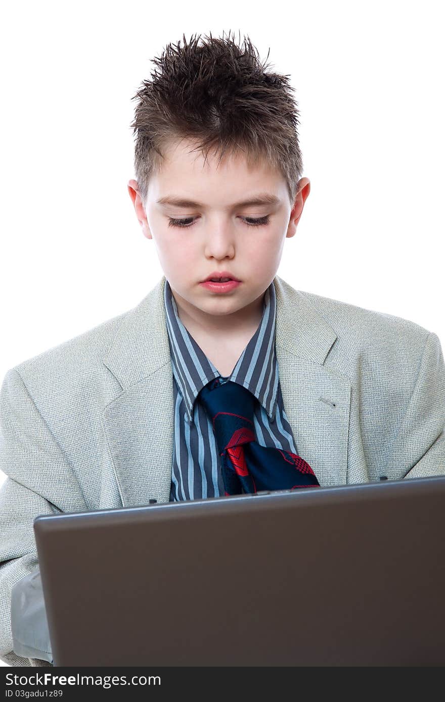 Portrait of a boy with a computer isolated on white. Portrait of a boy with a computer isolated on white