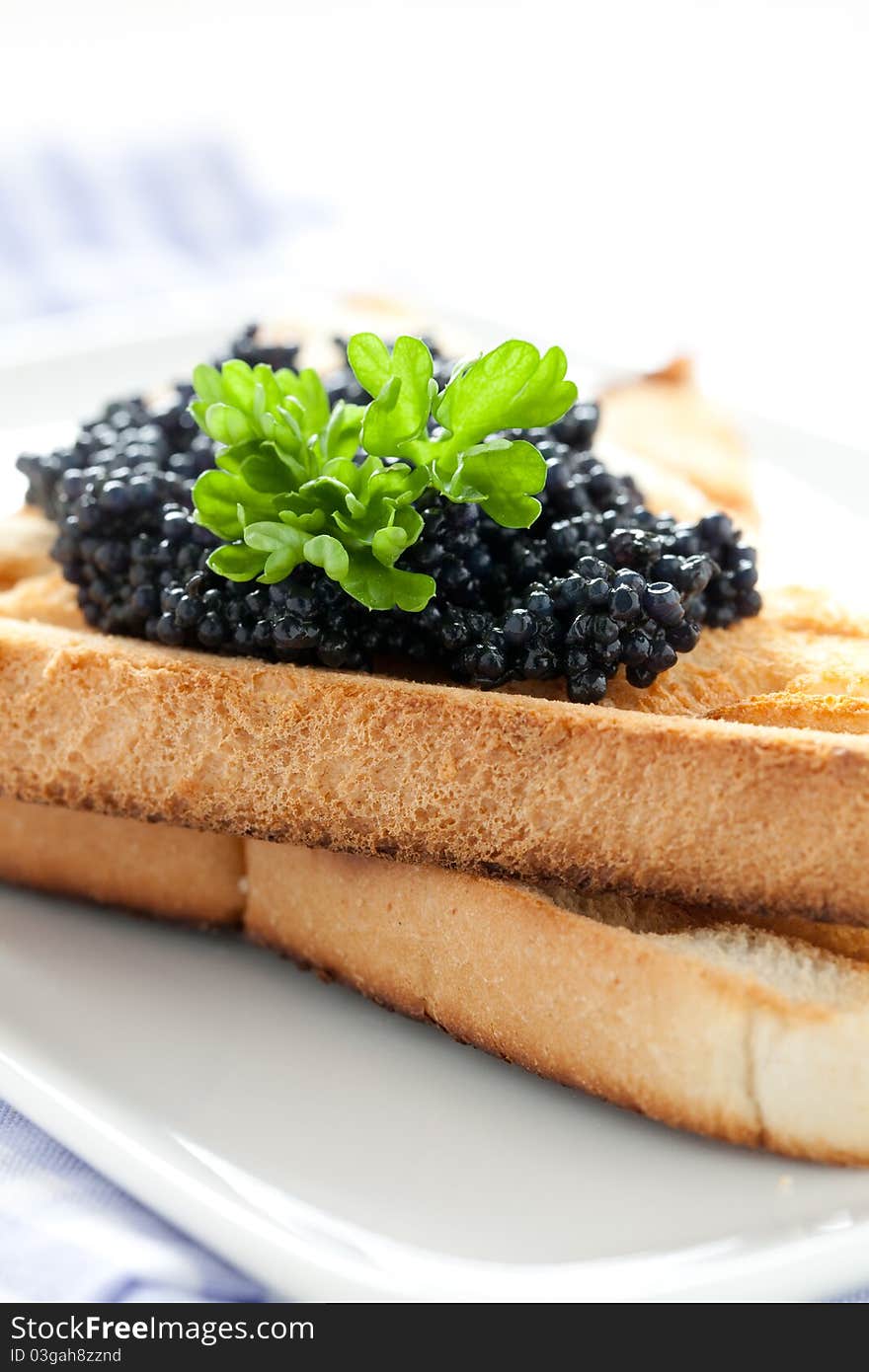 Black caviar on toast closeup