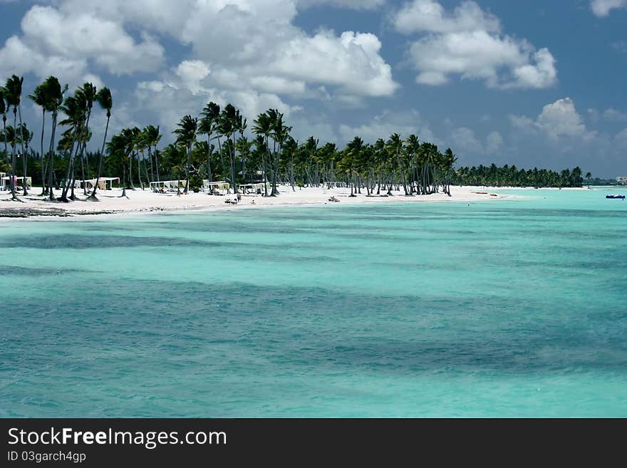 Turquoise ocean, white sand beach and palm trees. Turquoise ocean, white sand beach and palm trees