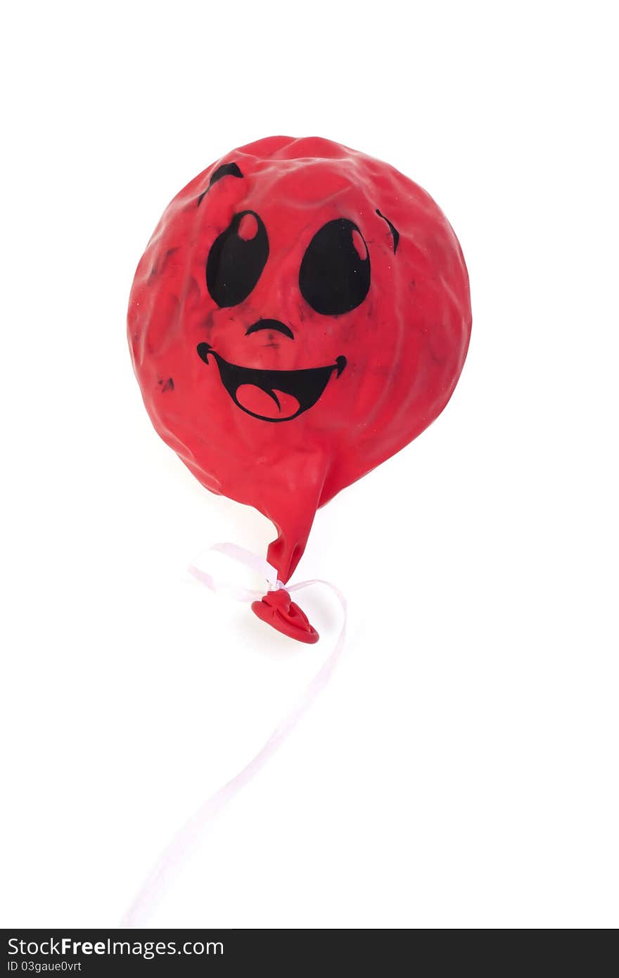 The red lowered sphere on a white background with the smilie image. The red lowered sphere on a white background with the smilie image