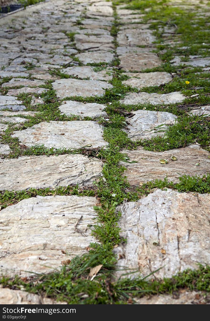 An old stone road with stone wall in Datca, Turkey. An old stone road with stone wall in Datca, Turkey