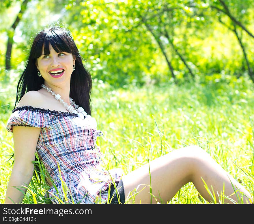 Single beautiful woman relaxing at the park. Single beautiful woman relaxing at the park