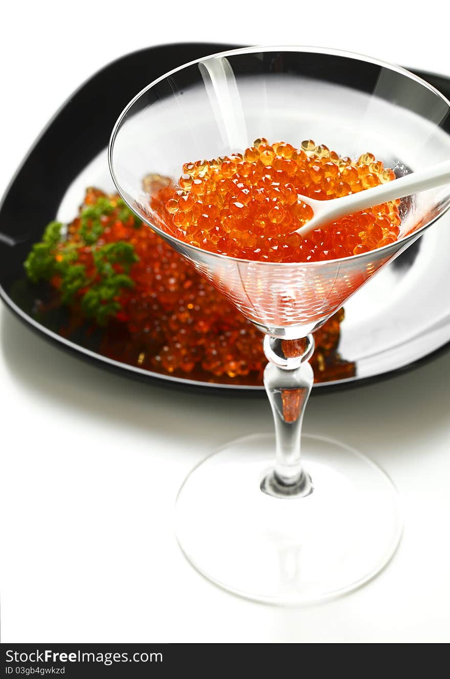 Red caviar on a white background