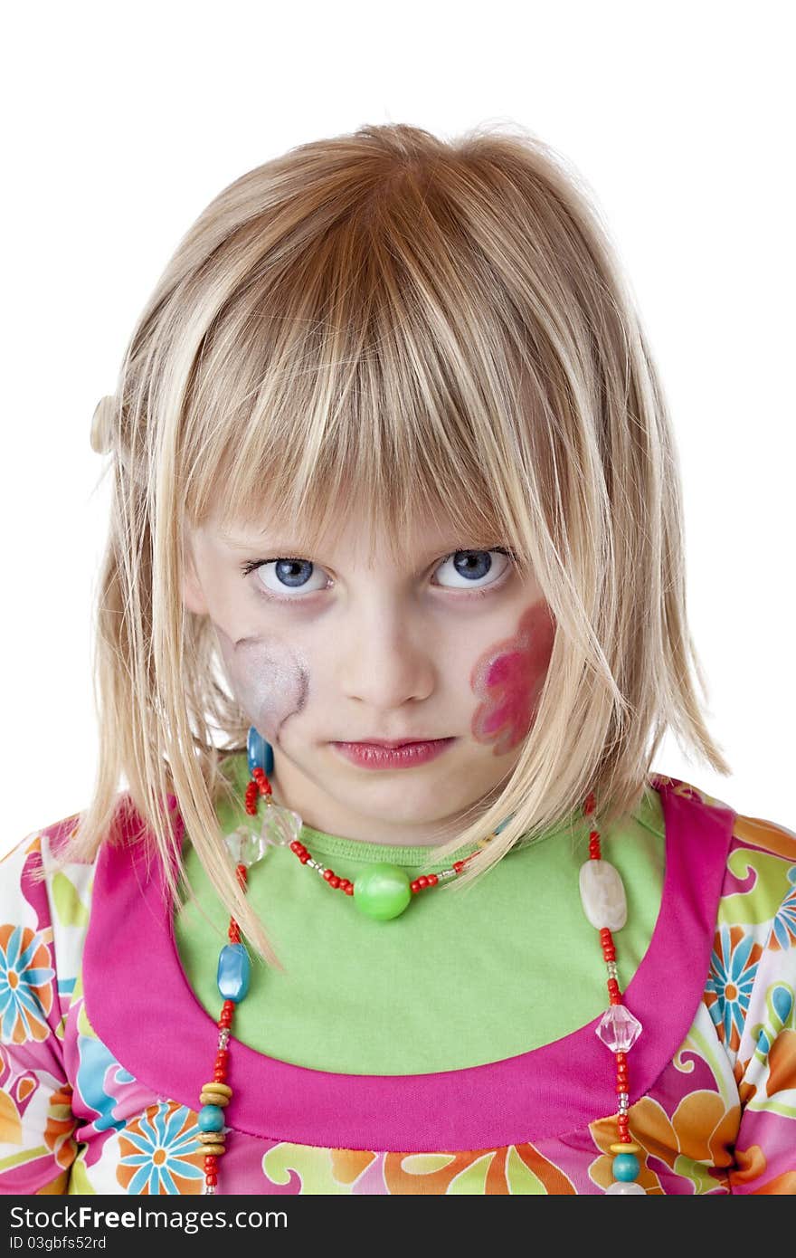 Blond disguised girl with painted cheeks looks serious.Isolated on white background. Blond disguised girl with painted cheeks looks serious.Isolated on white background.