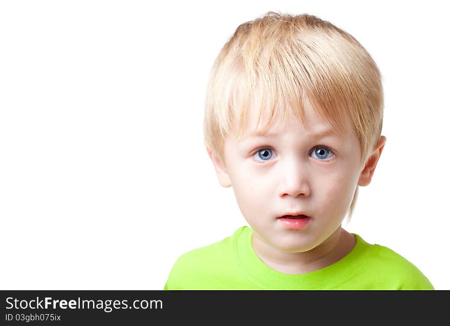 Boy of five years is focused and tense, close up, white background. Boy of five years is focused and tense, close up, white background