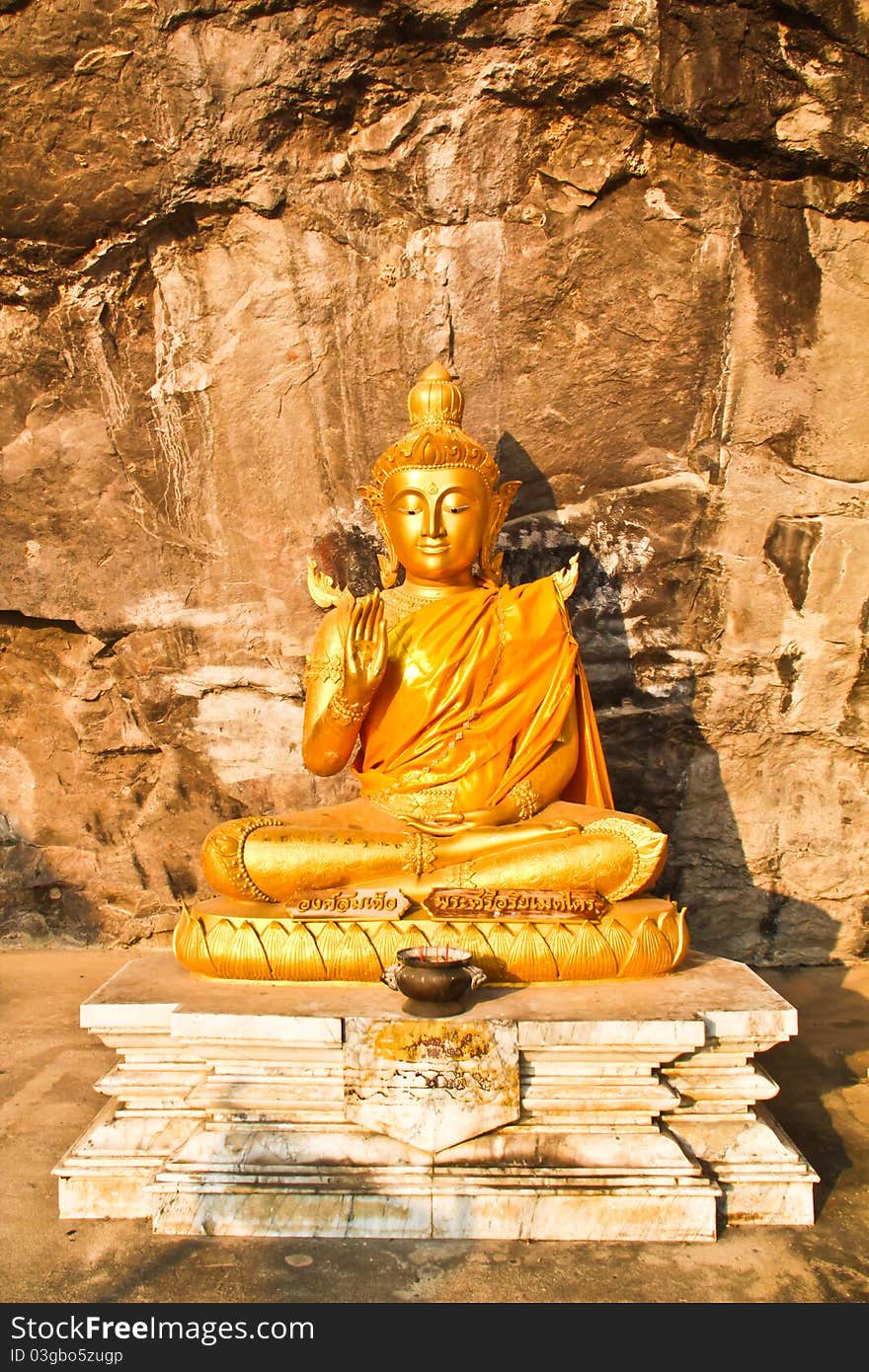 Peaceful golden Buddha in the mountain. Peaceful golden Buddha in the mountain