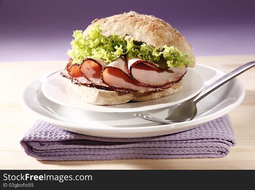 Very tasty roll with sliced ham. Very tasty roll with sliced ham