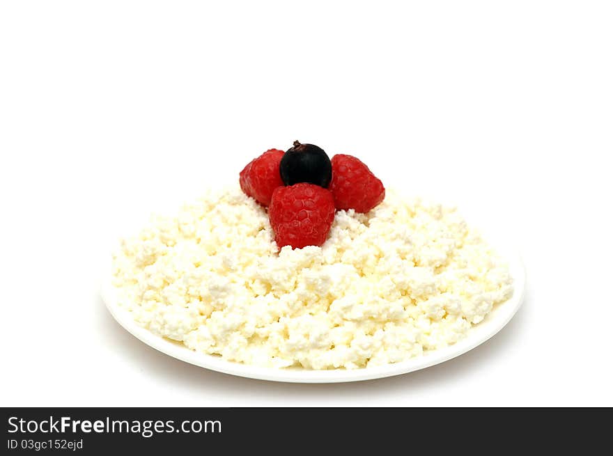 Cottage cheese with berries red ripe strawberries on the plate with isolated on a white background