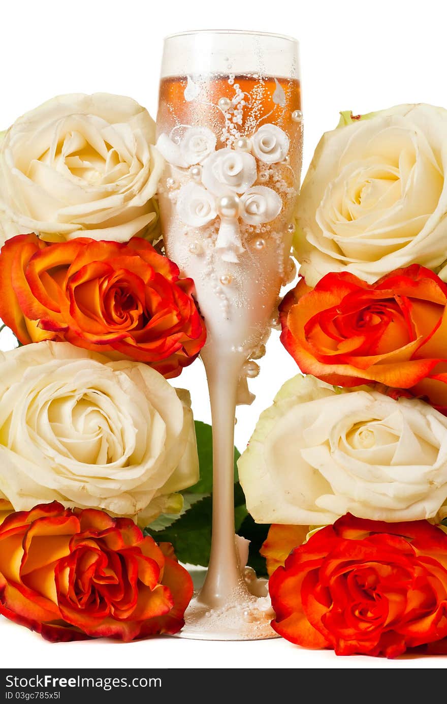 One glas of champagne and a roses against white background. One glas of champagne and a roses against white background.