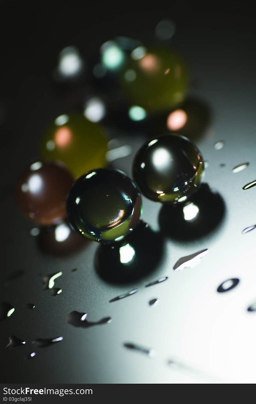 Abstract background with glass balls, water and light effects. Abstract background with glass balls, water and light effects