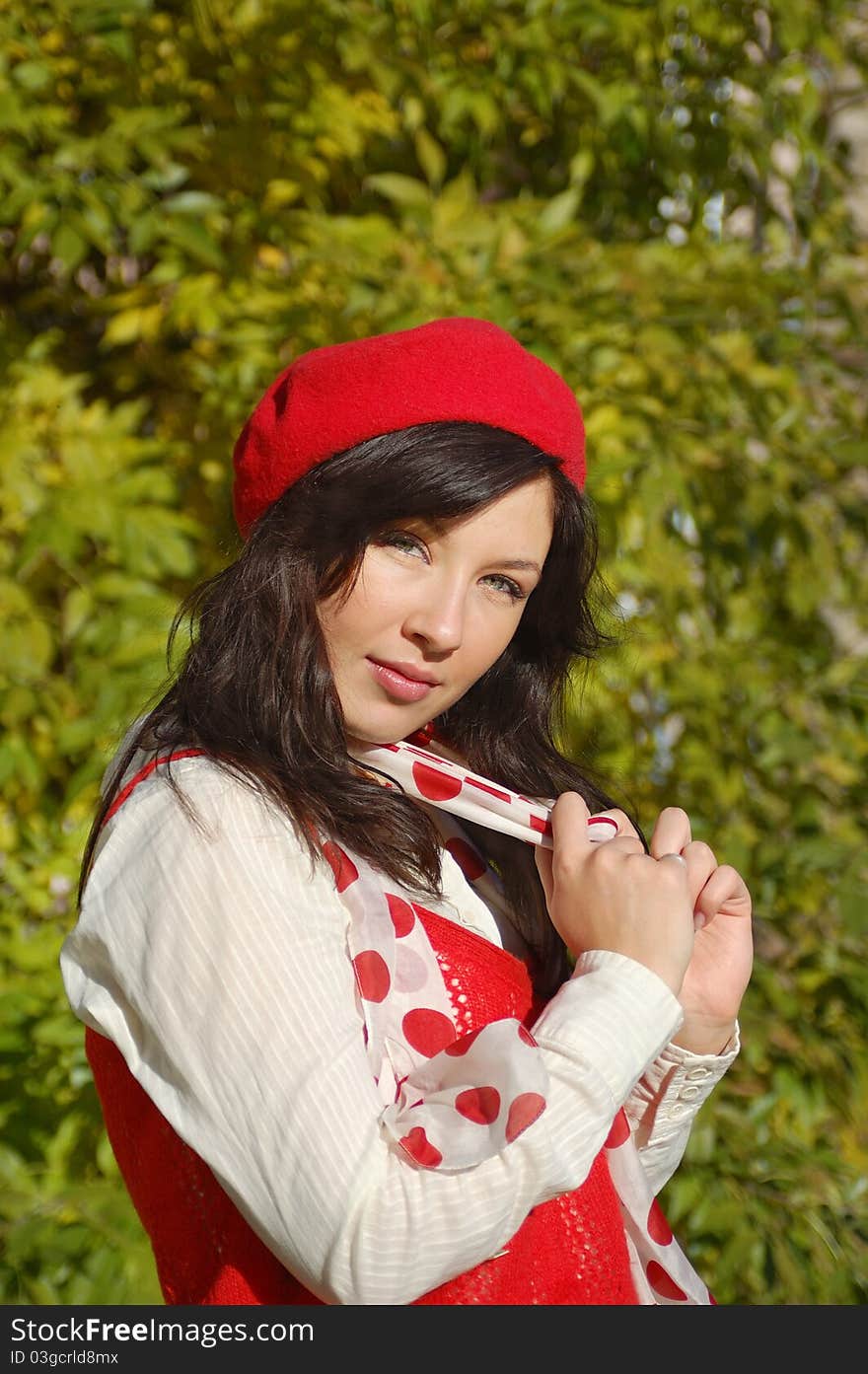 Nice girl in red beret looking at camera