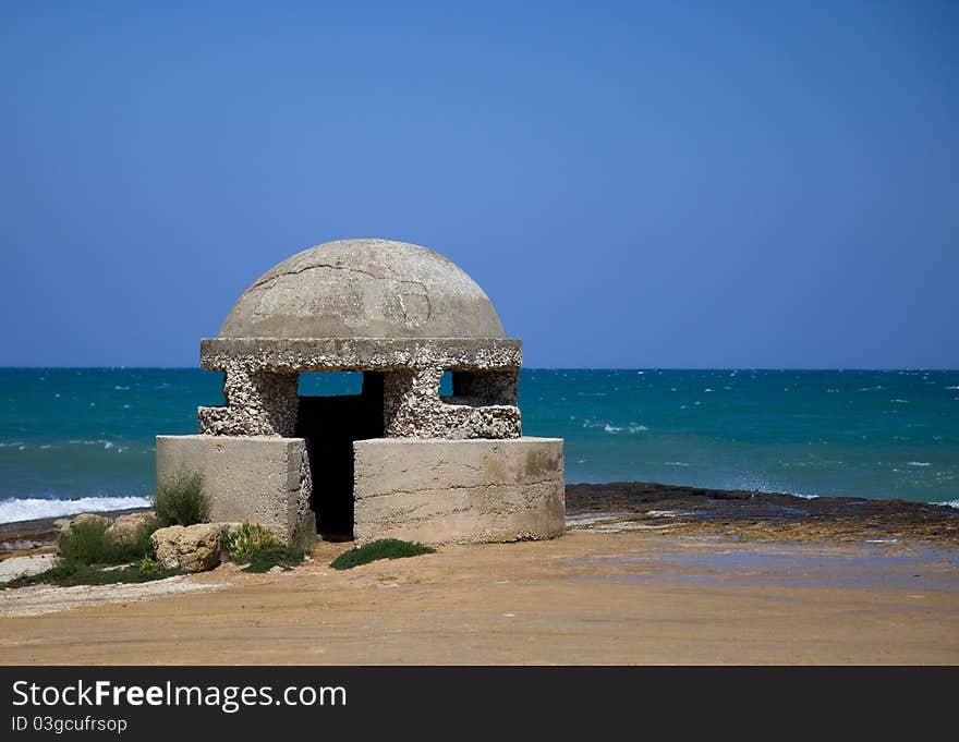 Bunker on the beach with blue sky