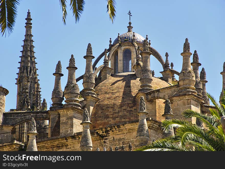 View of details dome, roof and spires of the Cathedral in Seville, Spain