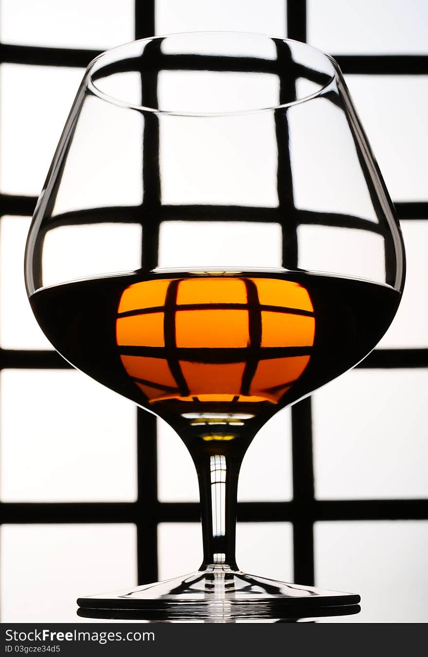 Cognac, whisky, rum, wine glass on old background. Cognac, whisky, rum, wine glass on old background