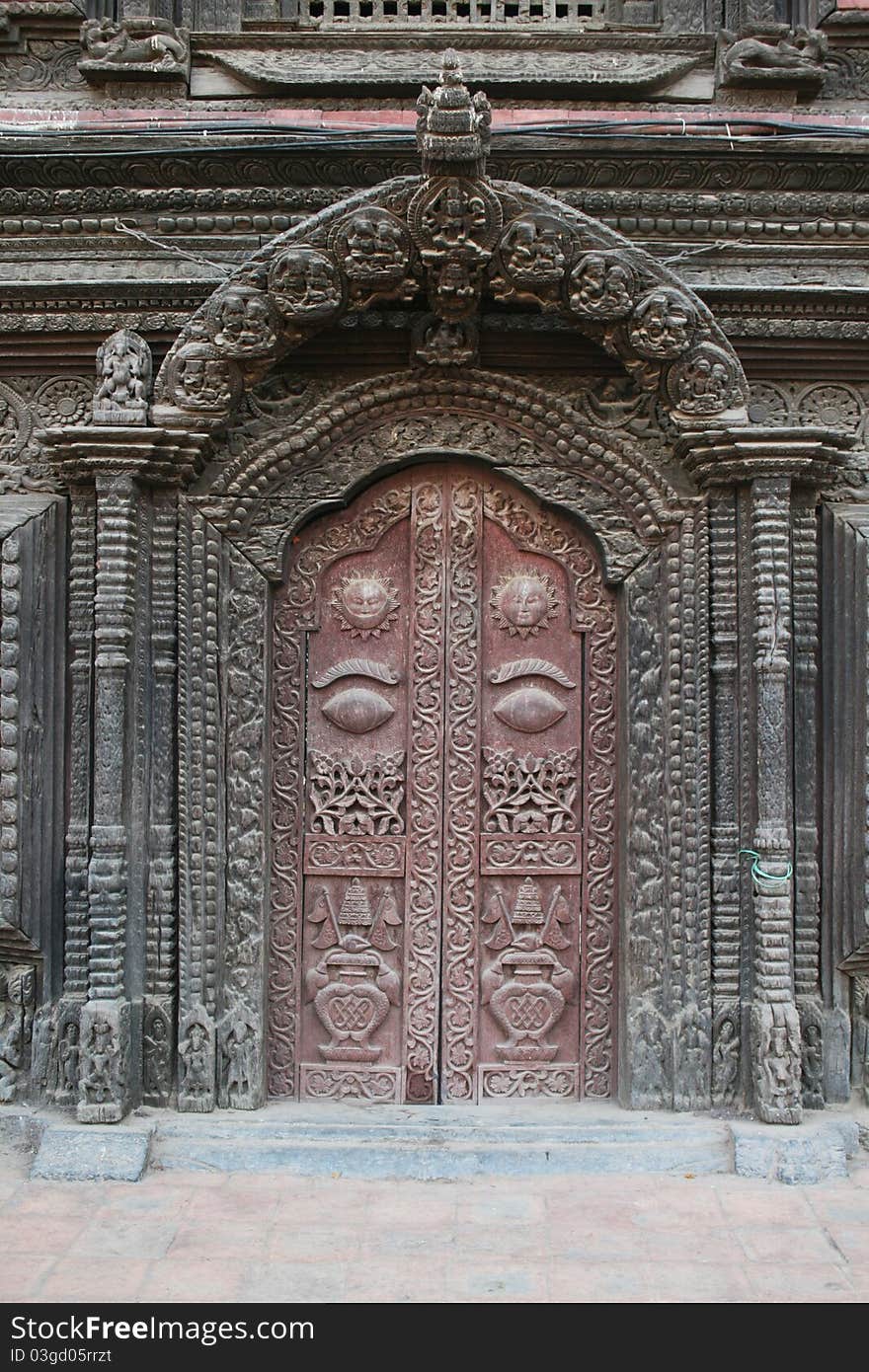 A typical fine carved door of the royal palace of patan in nepal. A typical fine carved door of the royal palace of patan in nepal