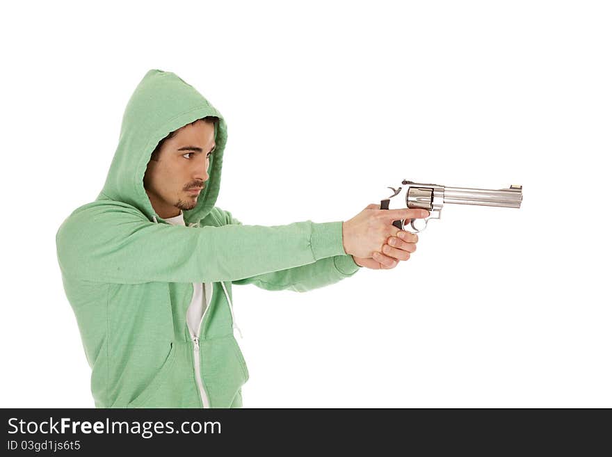 A man in green with a serious expression on his face pointing a gun. A man in green with a serious expression on his face pointing a gun.