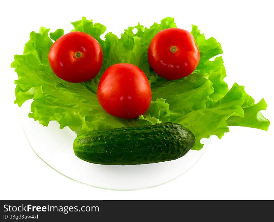 The vegetables lying on the transparent plate. The vegetables lying on the transparent plate