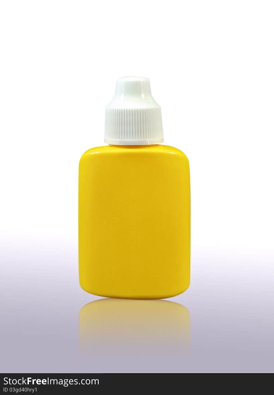 Yellow medicine dropper in plastic bottle. Yellow medicine dropper in plastic bottle