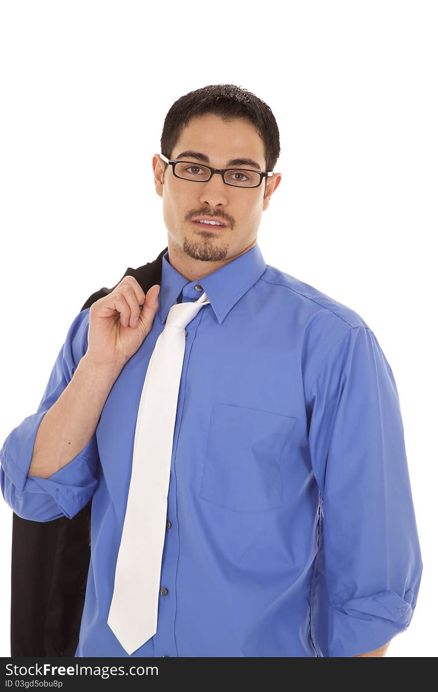 A man in a blue shirt holding his suit jacket over his shoulder. A man in a blue shirt holding his suit jacket over his shoulder.